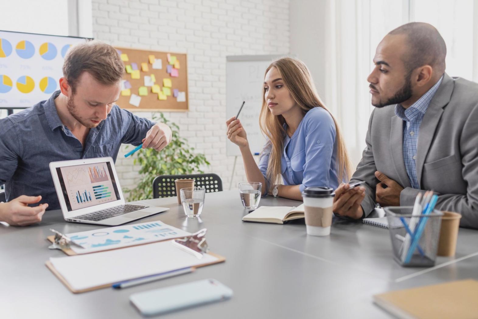 Finance professional presenting financial data to a diverse business audience